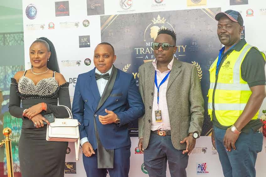 Guests on the red carpet in front of the sponsor backdrop at the Wezesha Awards 2026