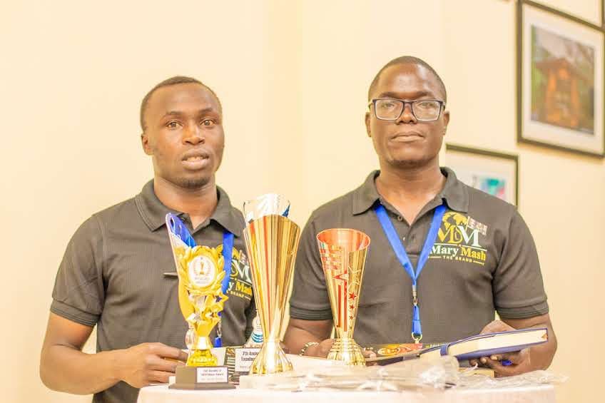Mary Mash team members in branded tees with the night’s trophies at the Wezesha Awards 2026
